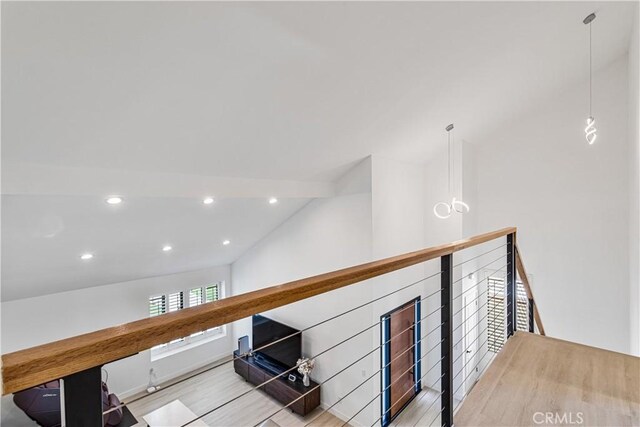 760 Featherwood Dr, Diamond Bar, CA 91765 - hallway with lofted ceiling, wood finished floors, recessed lighting, and an upstairs landing
