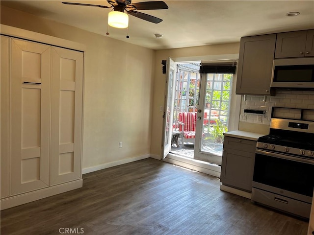 10709 Wheelock Cir, Whittier, CA 90606 - kitchen featuring baseboards, ceiling fan, dark wood finished floors, gray cabinetry, and stainless steel appliances