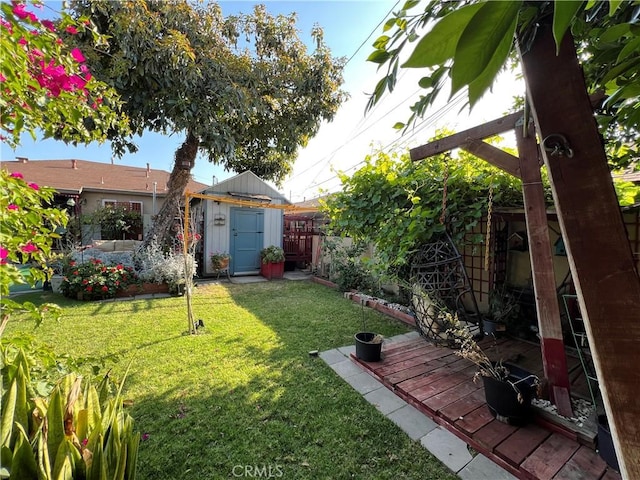 10709 Wheelock Cir, Whittier, CA 90606 - view of yard featuring fence and an outbuilding