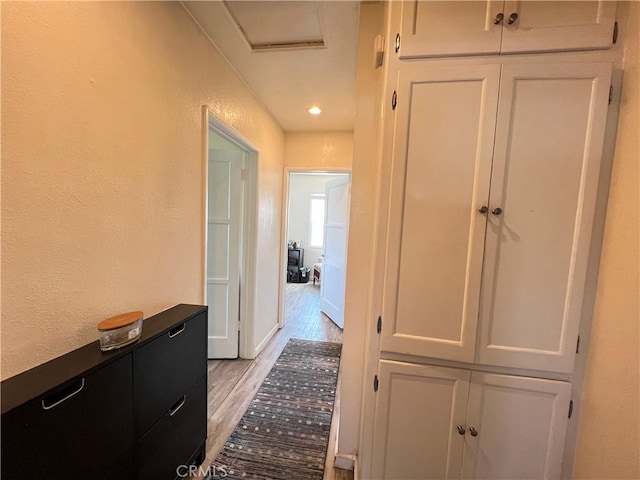 10709 Wheelock Cir, Whittier, CA 90606 - hallway featuring attic access, light wood-type flooring, baseboards, a textured wall, and recessed lighting