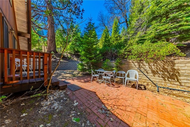 1163 Silvertip Ln, Fish Camp, CA 93623 - view of yard with outdoor dining area, a deck, a patio, and a fenced backyard