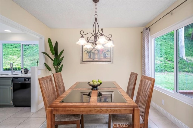 28143 Espinoza, Mission Viejo, CA 92692 - dining room featuring baseboards, a textured ceiling, a notable chandelier, and light tile patterned floors