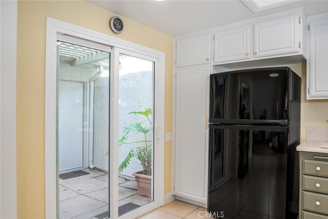28143 Espinoza, Mission Viejo, CA 92692 - kitchen featuring freestanding refrigerator, light tile patterned floors, white cabinets, and light countertops