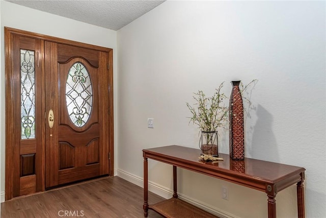 28143 Espinoza, Mission Viejo, CA 92692 - entryway with baseboards, a textured ceiling, and wood finished floors