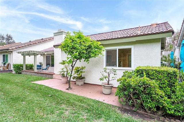 28143 Espinoza, Mission Viejo, CA 92692 - back of house with a pergola, a patio, stucco siding, a tiled roof, and a yard