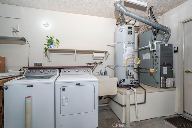 28143 Espinoza, Mission Viejo, CA 92692 - clothes washing area featuring laundry area, washing machine and dryer, a textured ceiling, a sink, and strapped water heater