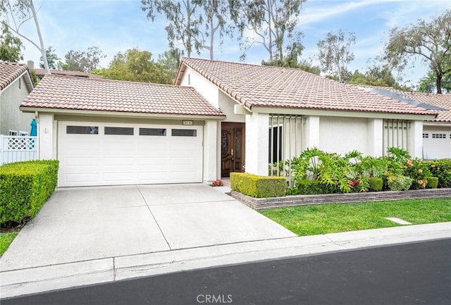 28143 Espinoza, Mission Viejo, CA 92692 - view of front of house with a garage, stucco siding, a tile roof, and concrete driveway