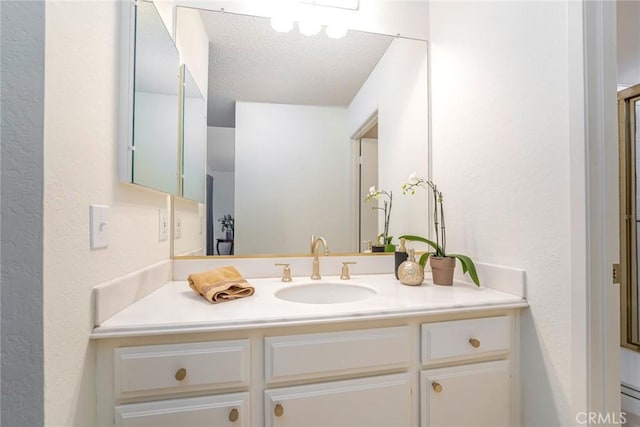 28143 Espinoza, Mission Viejo, CA 92692 - bathroom featuring vanity, a textured wall, and a textured ceiling