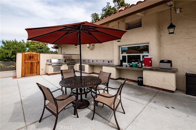 28143 Espinoza, Mission Viejo, CA 92692 - view of patio / terrace with outdoor dining space, exterior kitchen, fence, and a grill