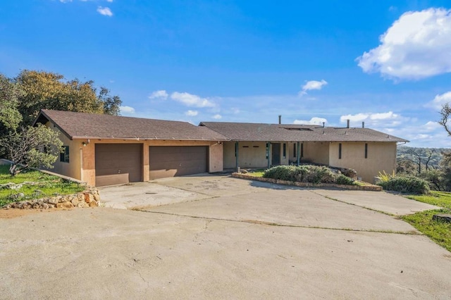 3252 Pine Hills Rd, Julian, CA 92036 - ranch-style home featuring concrete driveway, a garage, and stucco siding