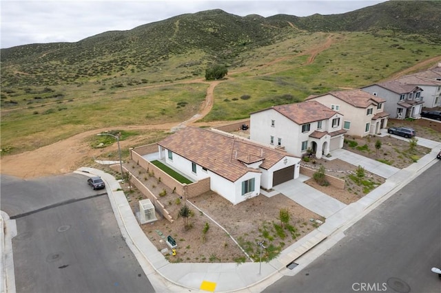 birds eye view of property with a mountain view