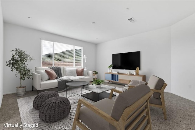 carpeted living area featuring visible vents