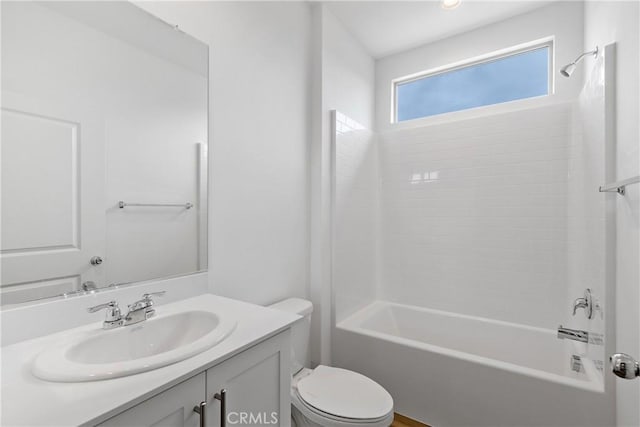 full bathroom featuring shower / bathing tub combination, vanity, and toilet