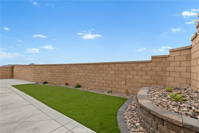 view of yard with a fenced backyard