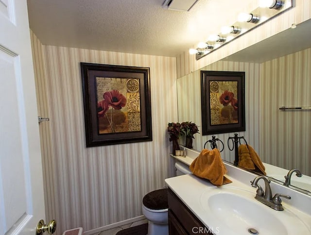 39675 Via Las Palmas, Murrieta, CA 92563 - bathroom with a textured ceiling, toilet, and wallpapered walls