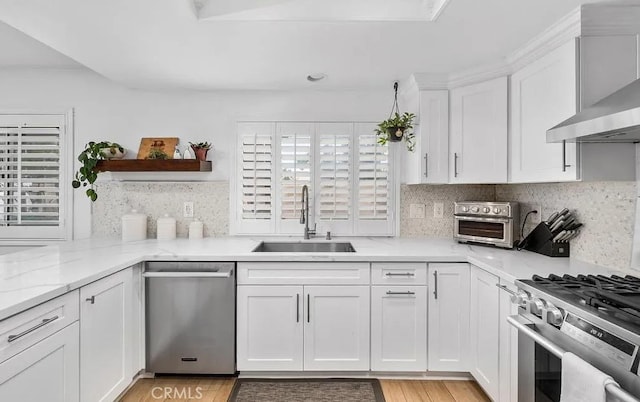 39675 Via Las Palmas, Murrieta, CA 92563 - kitchen with appliances with stainless steel finishes, open shelves, a sink, a toaster, and wall chimney exhaust hood