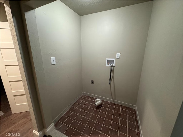 3723 Buckeye St, Clearlake, CA 95422 - laundry area with dark wood-style floors, hookup for an electric dryer, baseboards, hookup for a washing machine, and laundry area