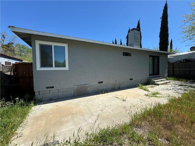 3723 Buckeye St, Clearlake, CA 95422 - rear view of house with fence, crawl space, entry steps, and a patio area