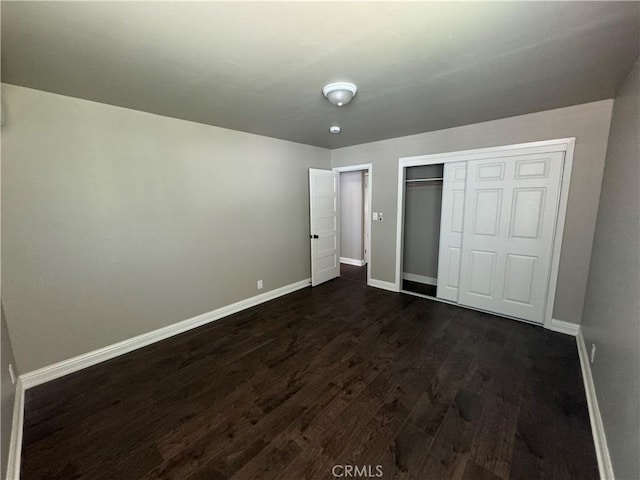 3723 Buckeye St, Clearlake, CA 95422 - unfurnished bedroom with dark wood finished floors, baseboards, and a closet