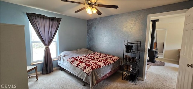 1929 Lebec Oaks Dr, Lebec, CA 93243 - bedroom with a ceiling fan, baseboards, carpet, and a wood stove