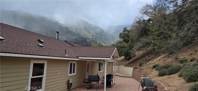 1929 Lebec Oaks Dr, Lebec, CA 93243 - rear view of house featuring fence, a mountain view, and a patio
