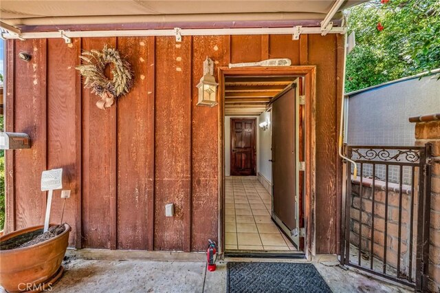 1341 E Harvest Moon St, West Covina, CA 91792 - property entrance with board and batten siding