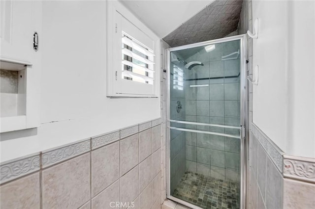 1341 E Harvest Moon St, West Covina, CA 91792 - full bathroom with a shower stall, tile walls, and wainscoting