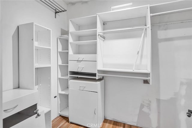 1341 E Harvest Moon St, West Covina, CA 91792 - walk in closet featuring wood finished floors