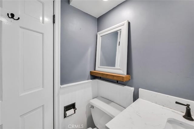 1341 E Harvest Moon St, West Covina, CA 91792 - half bathroom with toilet, a sink, and a wainscoted wall