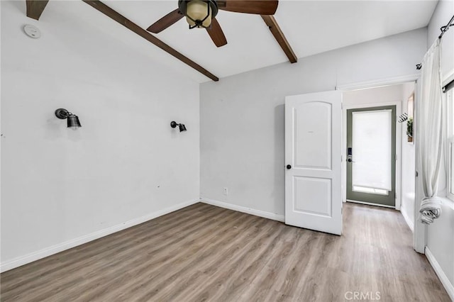 1341 E Harvest Moon St, West Covina, CA 91792 - empty room with light wood finished floors, a ceiling fan, baseboards, and a smoke detector