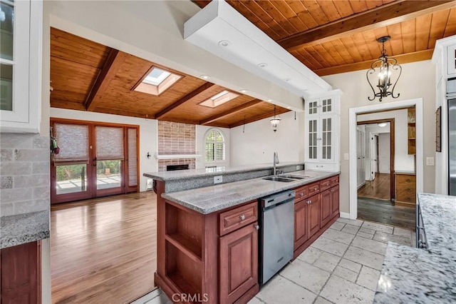 1341 E Harvest Moon St, West Covina, CA 91792 - kitchen featuring wood ceiling with exposed beams, dishwasher, a sink, open floor plan, and a brick fireplace