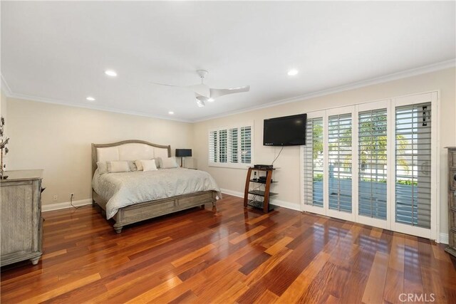 bedroom with wood finished floors, access to outside, and crown molding