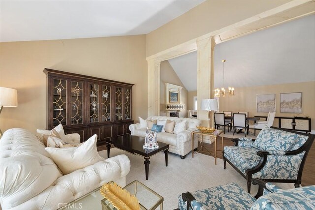 living area featuring lofted ceiling, carpet, and a notable chandelier