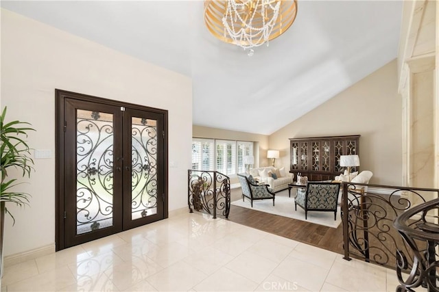 11030 Cozycroft Ave, Chatsworth, CA 91311 - foyer entrance with a chandelier, french doors, and high vaulted ceiling