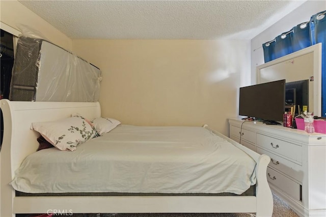 1010 Margarita Dr Unit B201, Corona, CA 92879 - bedroom featuring a textured ceiling
