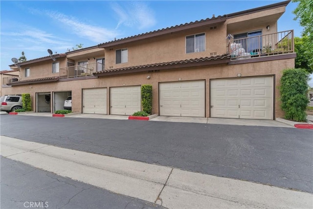 1010 Margarita Dr Unit B201, Corona, CA 92879 - view of front of home featuring stucco siding and a balcony