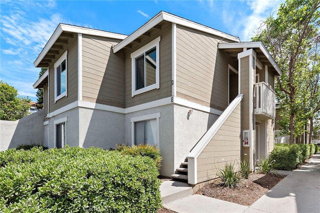 view of side of property featuring stucco siding