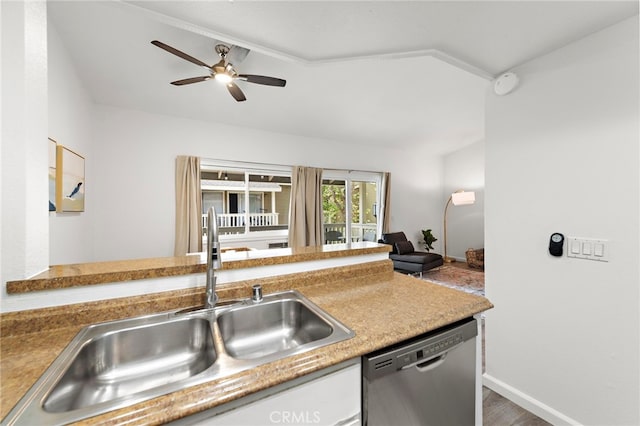 kitchen featuring white cabinets, ceiling fan, a sink, dishwasher, and baseboards