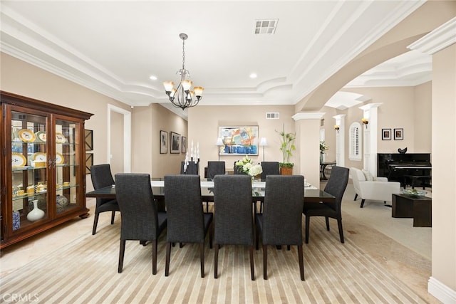 15841 Aurora Crest Dr, Whittier, CA 90605 - dining room with ornate columns, arched walkways, light colored carpet, a chandelier, and crown molding