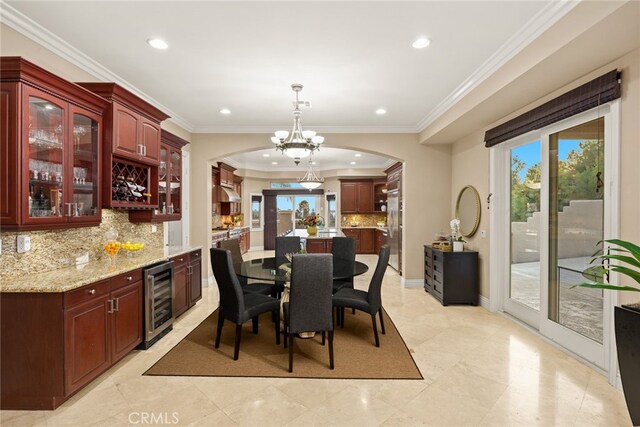 15841 Aurora Crest Dr, Whittier, CA 90605 - dining room with beverage cooler, arched walkways, recessed lighting, plenty of natural light, and a chandelier