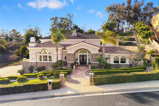 15841 Aurora Crest Dr, Whittier, CA 90605 - mediterranean / spanish home featuring french doors, stone siding, a chimney, and a tiled roof