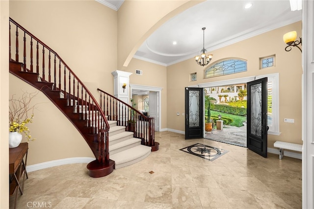 15841 Aurora Crest Dr, Whittier, CA 90605 - foyer featuring a high ceiling, baseboards, stairs, ornamental molding, and arched walkways