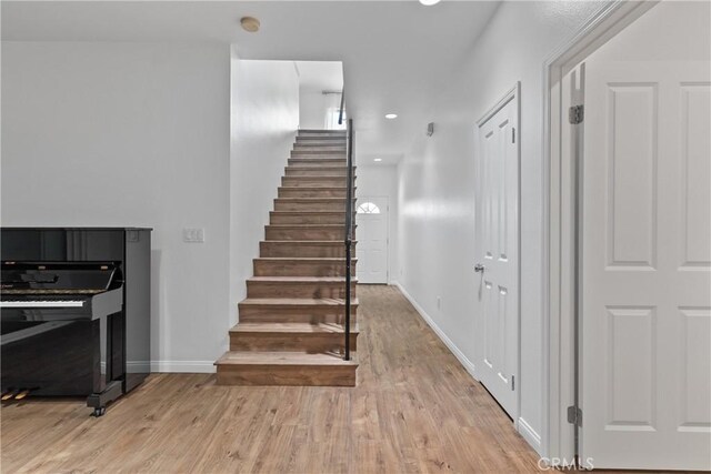 247 W 223rd St Unit D, Carson, CA 90745 - stairway featuring wood finished floors, baseboards, and recessed lighting