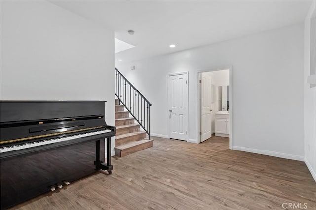 247 W 223rd St Unit D, Carson, CA 90745 - entryway featuring wood finished floors, baseboards, stairs, and recessed lighting