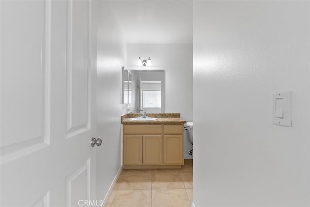 247 W 223rd St Unit D, Carson, CA 90745 - half bathroom featuring vanity, tile patterned flooring, toilet, and baseboards