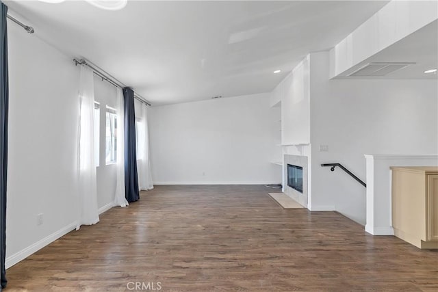 247 W 223rd St Unit D, Carson, CA 90745 - unfurnished living room featuring wood finished floors, a fireplace, baseboards, and recessed lighting