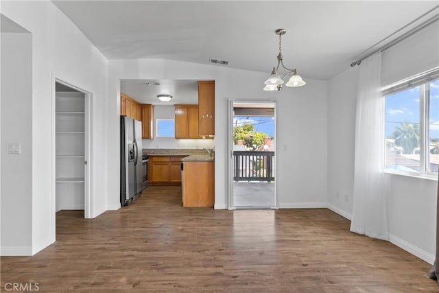 247 W 223rd St Unit D, Carson, CA 90745 - kitchen featuring stainless steel refrigerator with ice dispenser, dark wood-type flooring, a chandelier, baseboards, and decorative light fixtures