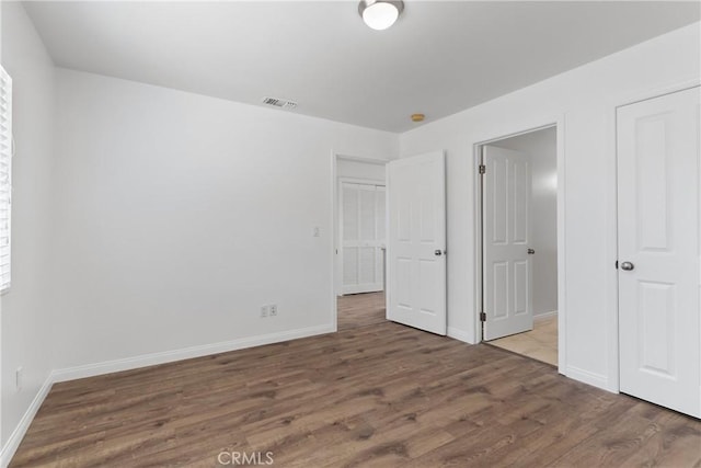 247 W 223rd St Unit D, Carson, CA 90745 - unfurnished bedroom with wood finished floors and baseboards