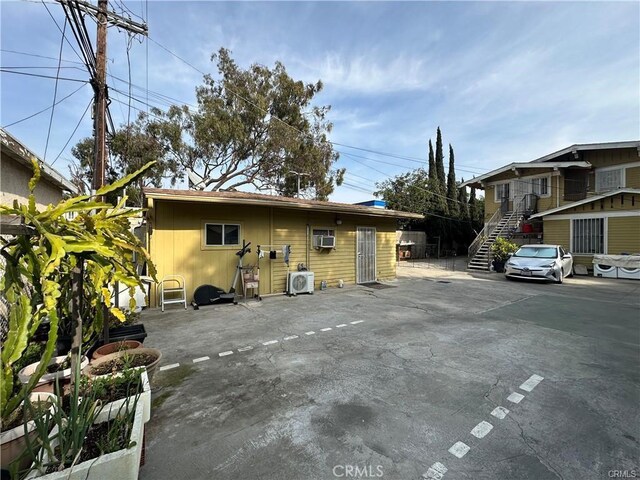 1929 Crenshaw Blvd, Los Angeles, CA 90016 - rear view of property featuring ac unit and stairway