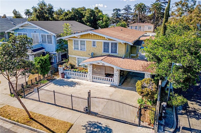1929 Crenshaw Blvd, Los Angeles, CA 90016 - view of front of property featuring a gate, driveway, a porch, and a fenced front yard